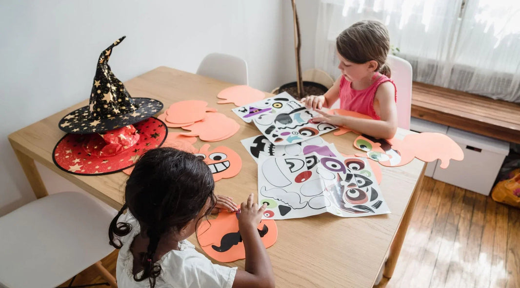Girls making halloween masks
