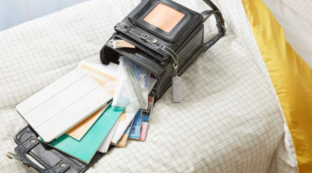 Small bag open with items inside