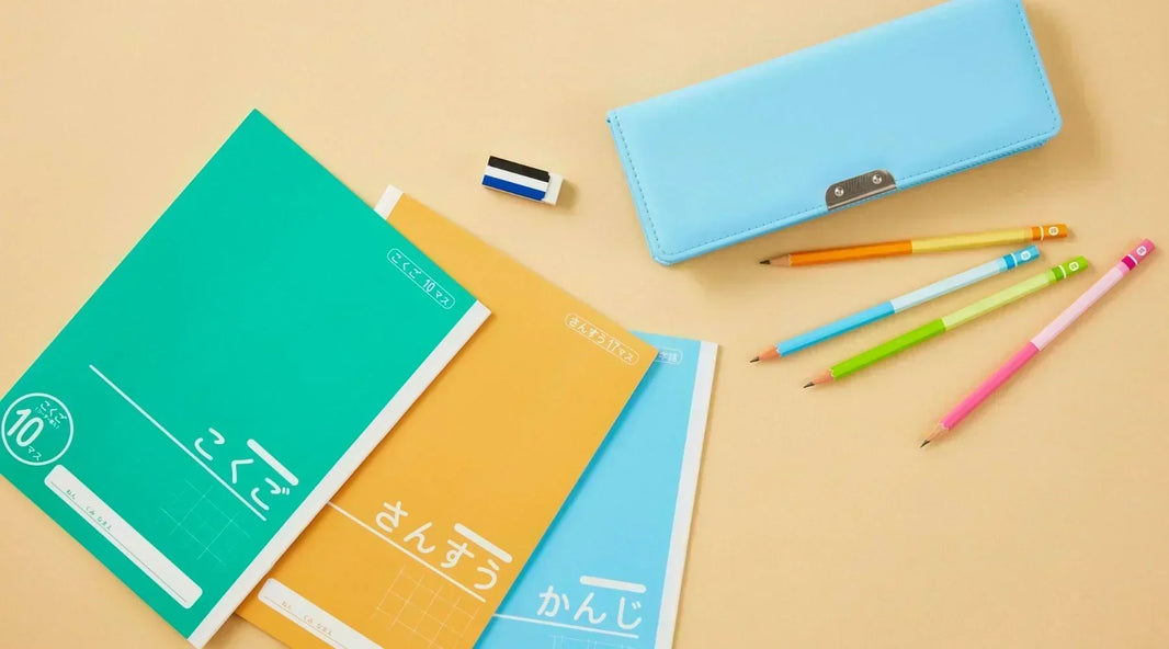 Notebook, pens, and pencil case