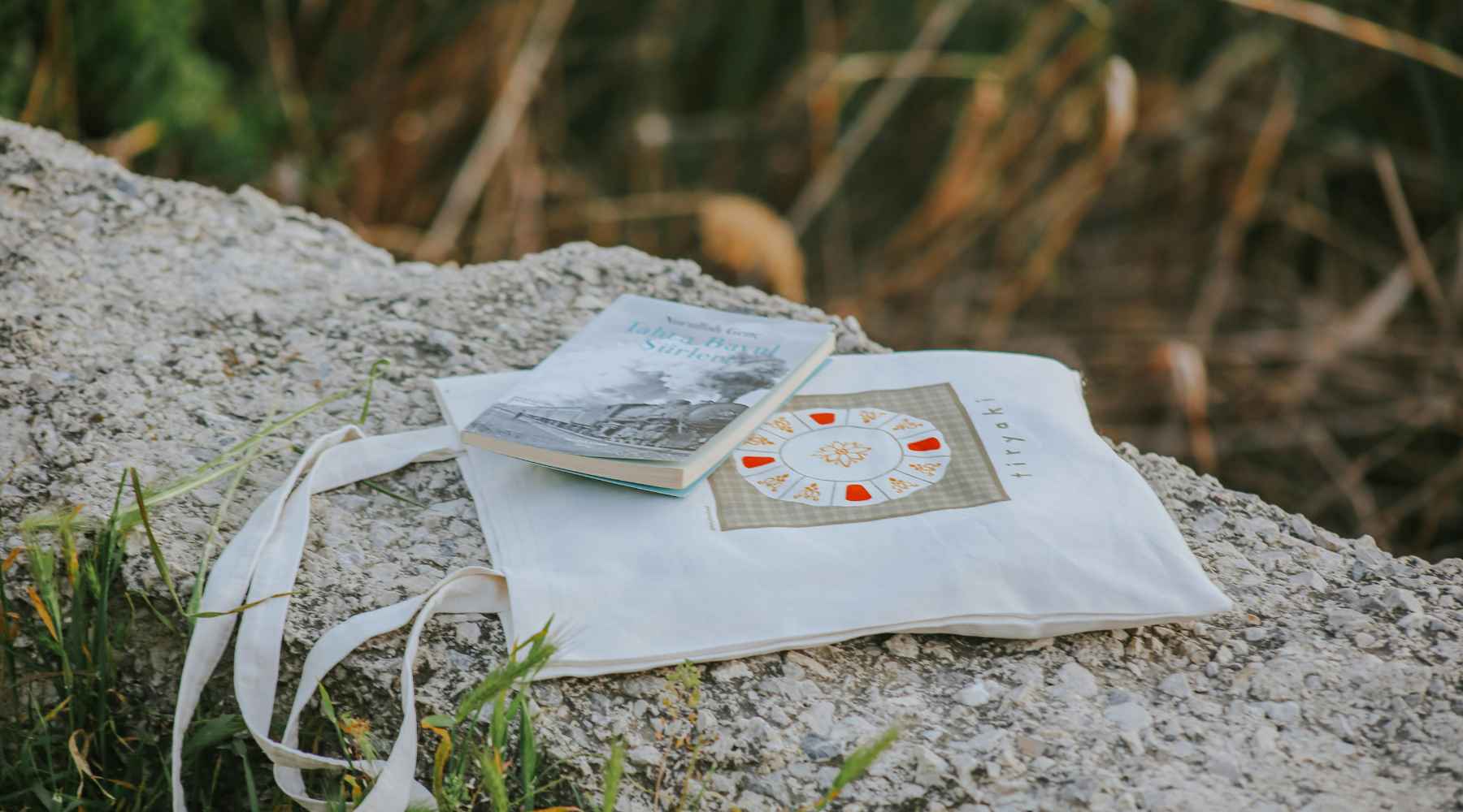 White tote bag and book