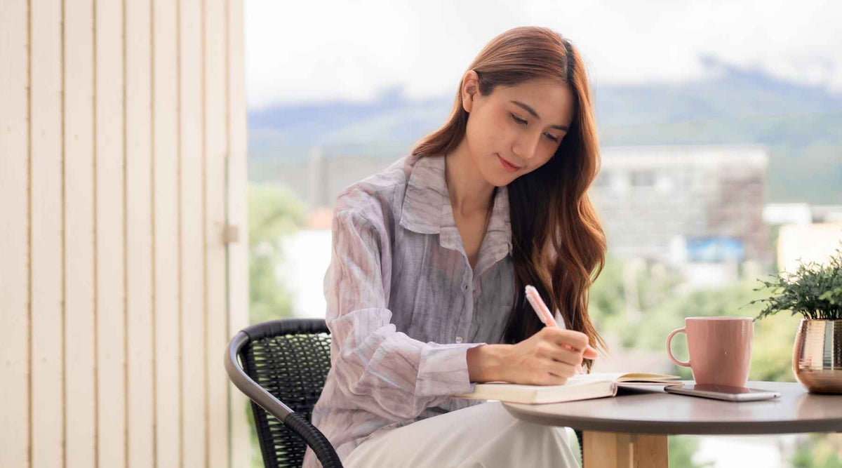 Woman writing in journal