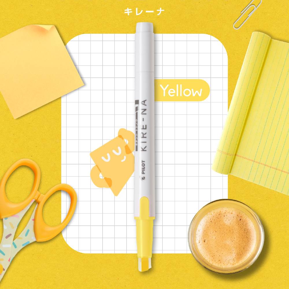 Kuretake marker on a yellow background with stationery items