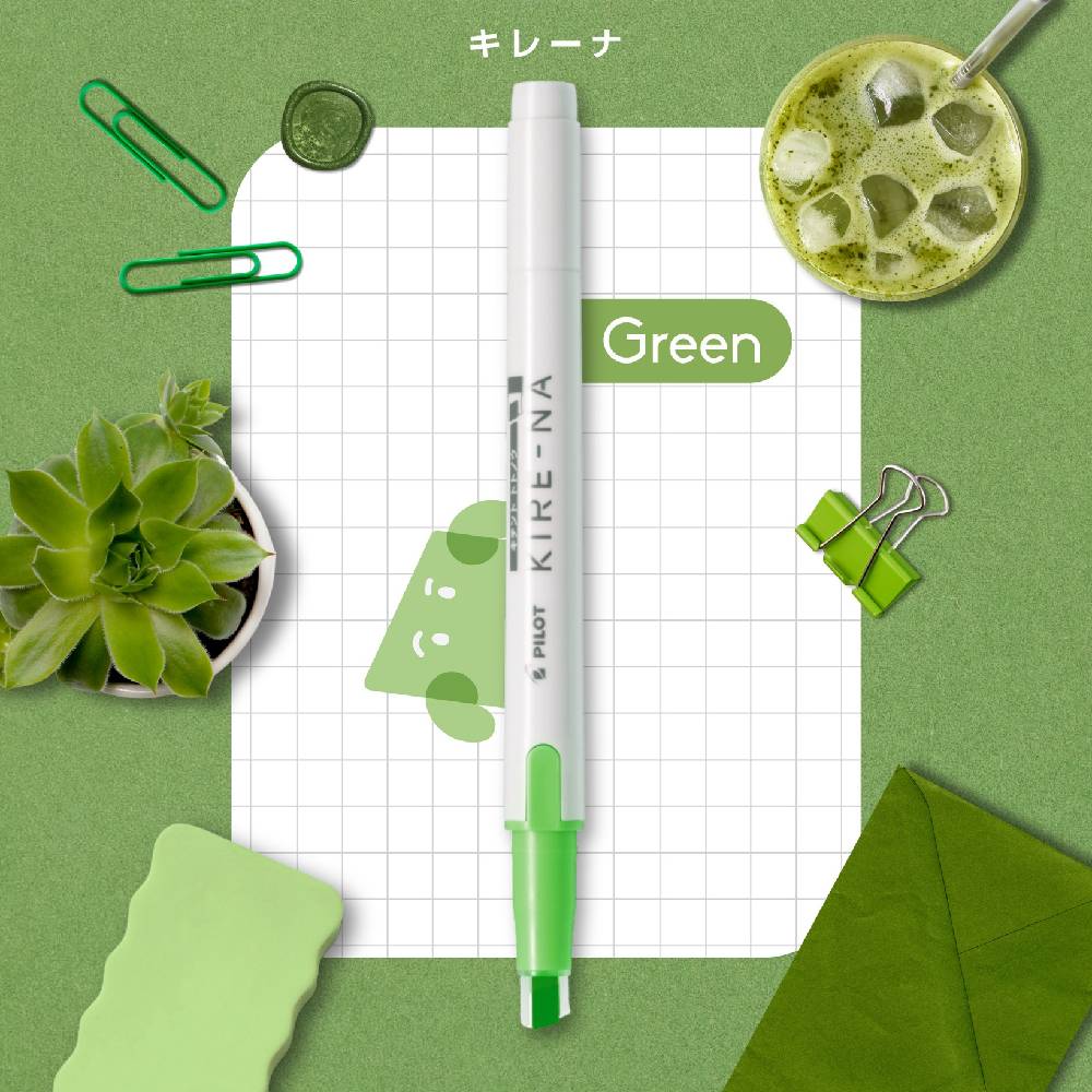 Green marker on a green background with stationery items