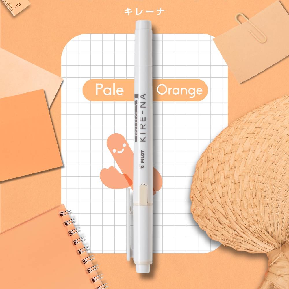 Pilot KIRE-NA pen on a grid notebook with orange accents and stationery items.